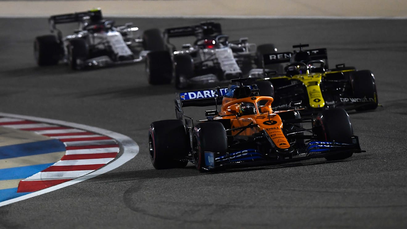 BAHRAIN, BAHRAIN - DECEMBER 06: Carlos Sainz of Spain driving the (55) McLaren F1 Team MCL35 Renault leads Daniel Ricciardo of Australia driving the (3) Renault Sport Formula One Team RS20 on track during the F1 Grand Prix of Sakhir at Bahrain International Circuit on December 06, 2020 in Bahrain, Bahrain. (Photo by Rudy Carezzevoli/Getty Images)