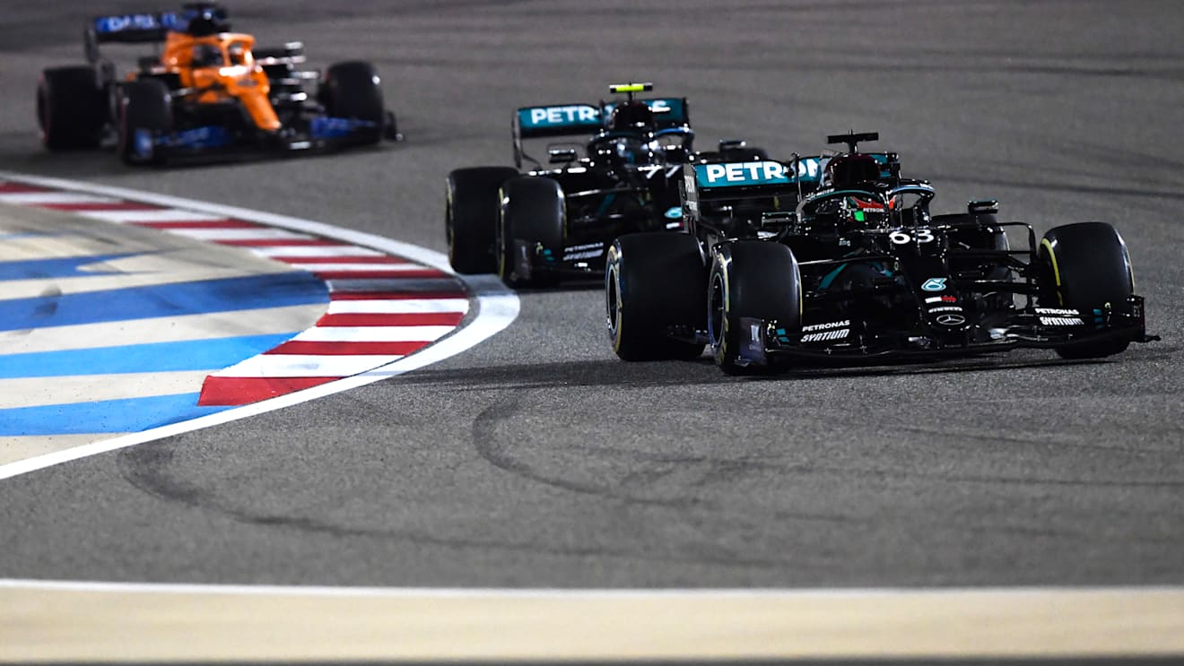 BAHRAIN, BAHRAIN - DECEMBER 06: George Russell of Great Britain driving the (63) Mercedes AMG Petronas F1 Team Mercedes W11 leads Valtteri Bottas of Finland driving the (77) Mercedes AMG Petronas F1 Team Mercedes W11 on track during the F1 Grand Prix of Sakhir at Bahrain International Circuit on December 06, 2020 in Bahrain, Bahrain. (Photo by Rudy Carezzevoli/Getty Images)