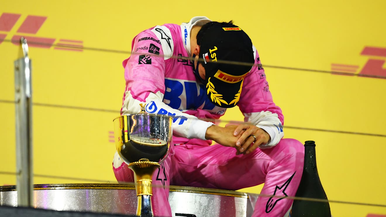 BAHRAIN, BAHRAIN - DECEMBER 06: Race winner Sergio Perez of Mexico and Racing Point celebrates his maiden F1 victory on the podium during the F1 Grand Prix of Sakhir at Bahrain International Circuit on December 06, 2020 in Bahrain, Bahrain. (Photo by Clive Mason - Formula 1/Formula 1 via Getty Images)