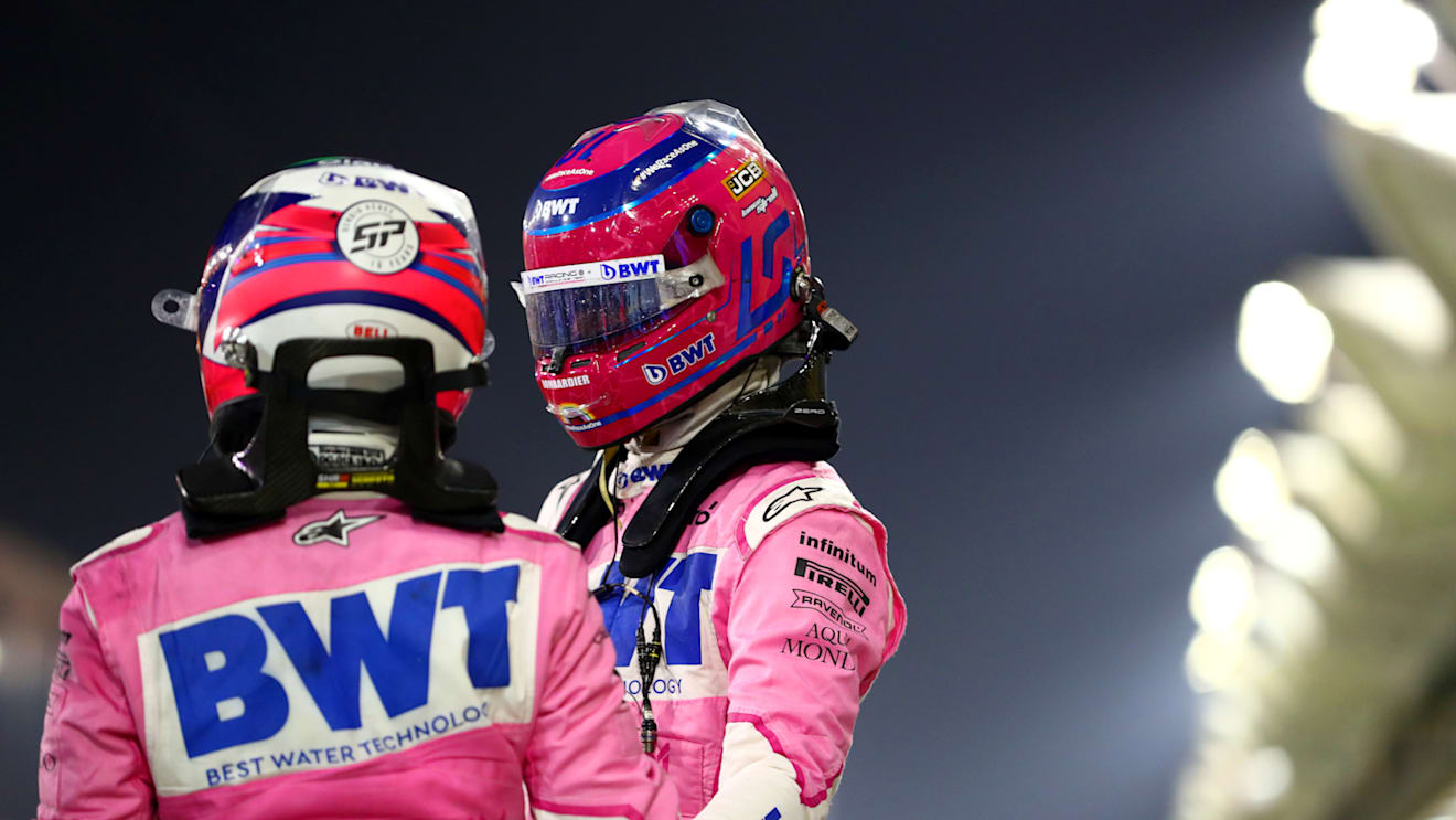 BAHRAIN, BAHRAIN - DECEMBER 06: Race winner Sergio Perez of Mexico and Racing Point and third placed Lance Stroll of Canada and Racing Point celebrate in parc ferme during the F1 Grand Prix of Sakhir at Bahrain International Circuit on December 06, 2020 in Bahrain, Bahrain. (Photo by Dan Istitene - Formula 1/Formula 1 via Getty Images)