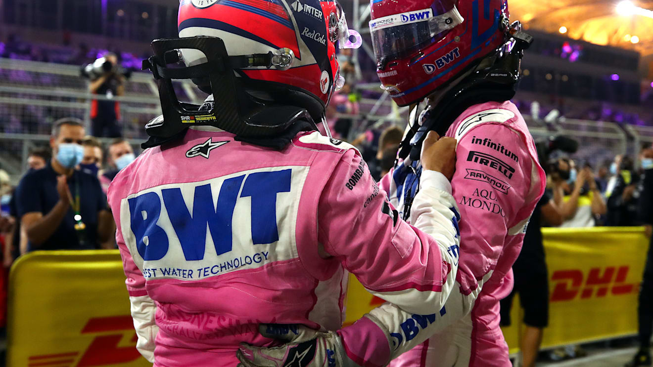 BAHRAIN, BAHRAIN - DECEMBER 06: Race winner Sergio Perez of Mexico and Racing Point and third placed Lance Stroll of Canada and Racing Point celebrate in parc ferme during the F1 Grand Prix of Sakhir at Bahrain International Circuit on December 06, 2020 in Bahrain, Bahrain. (Photo by Bryn Lennon/Getty Images)