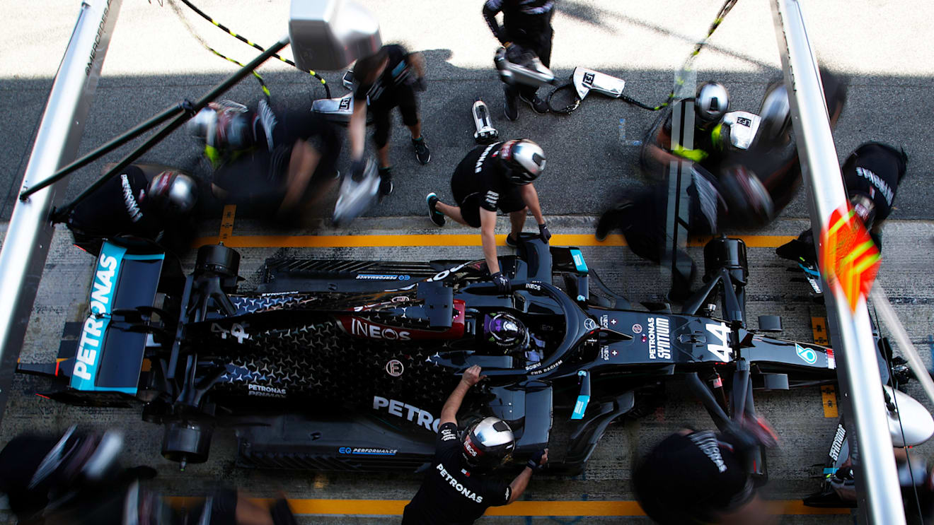 BARCELONA, SPAIN - AUGUST 14: Lewis Hamilton of Great Britain driving the (44) Mercedes AMG Petronas F1 Team Mercedes W11 stops in the Pitlane during practice for the F1 Grand Prix of Spain at Circuit de Barcelona-Catalunya on August 14, 2020 in Barcelona, Spain. (Photo by Emiliano Morenatti/Pool via Getty Images)
