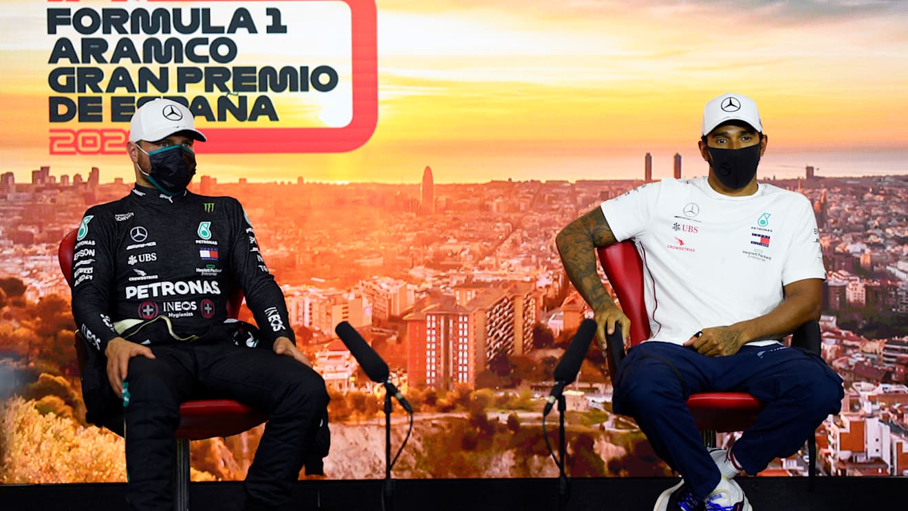 BARCELONA, SPAIN - AUGUST 15: Pole position qualifier Lewis Hamilton of Great Britain and Mercedes GP and second placed qualifier Valtteri Bottas of Finland and Mercedes GP talk in the Drivers Press Conference after qualifying for the F1 Grand Prix of Spain at Circuit de Barcelona-Catalunya on August 15, 2020 in Barcelona, Spain. (Photo by Rudy Carezzevoli/Getty Images)