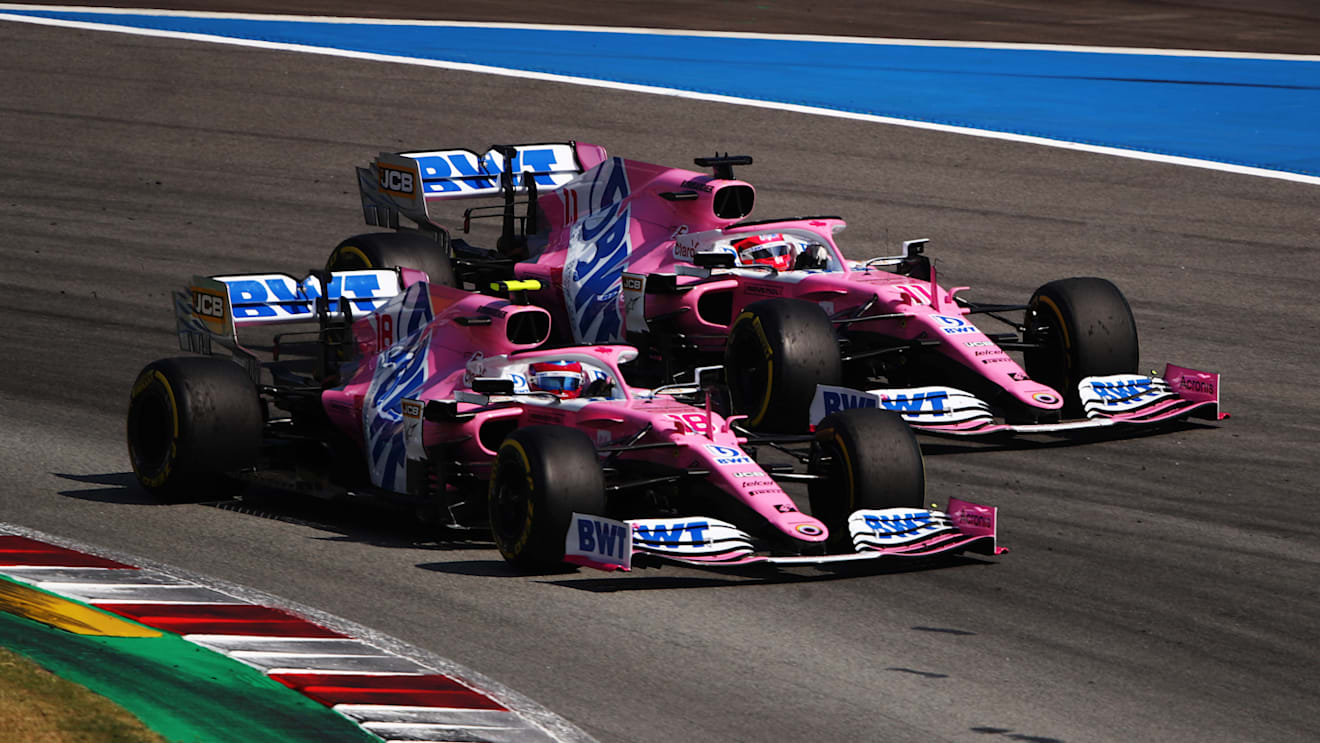 BARCELONA, SPAIN - AUGUST 16: Lance Stroll of Canada driving the (18) Racing Point RP20 Mercedes and Sergio Perez of Mexico driving the (11) Racing Point RP20 Mercedes battle for position during the F1 Grand Prix of Spain at Circuit de Barcelona-Catalunya on August 16, 2020 in Barcelona, Spain. (Photo by Bryn Lennon/Getty Images)