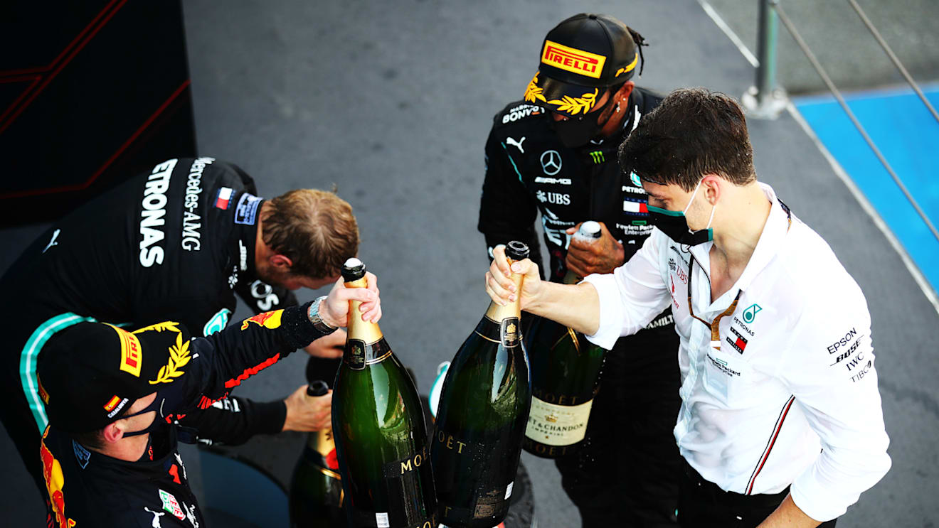 BARCELONA, SPAIN - AUGUST 16: Race winner Lewis Hamilton of Great Britain and Mercedes GP,  second placed Max Verstappen of Netherlands and Red Bull Racing and third placed Valtteri Bottas of Finland and Mercedes GP celebrate on the podium during the F1 Grand Prix of Spain at Circuit de Barcelona-Catalunya on August 16, 2020 in Barcelona, Spain. (Photo by Bryn Lennon/Getty Images)