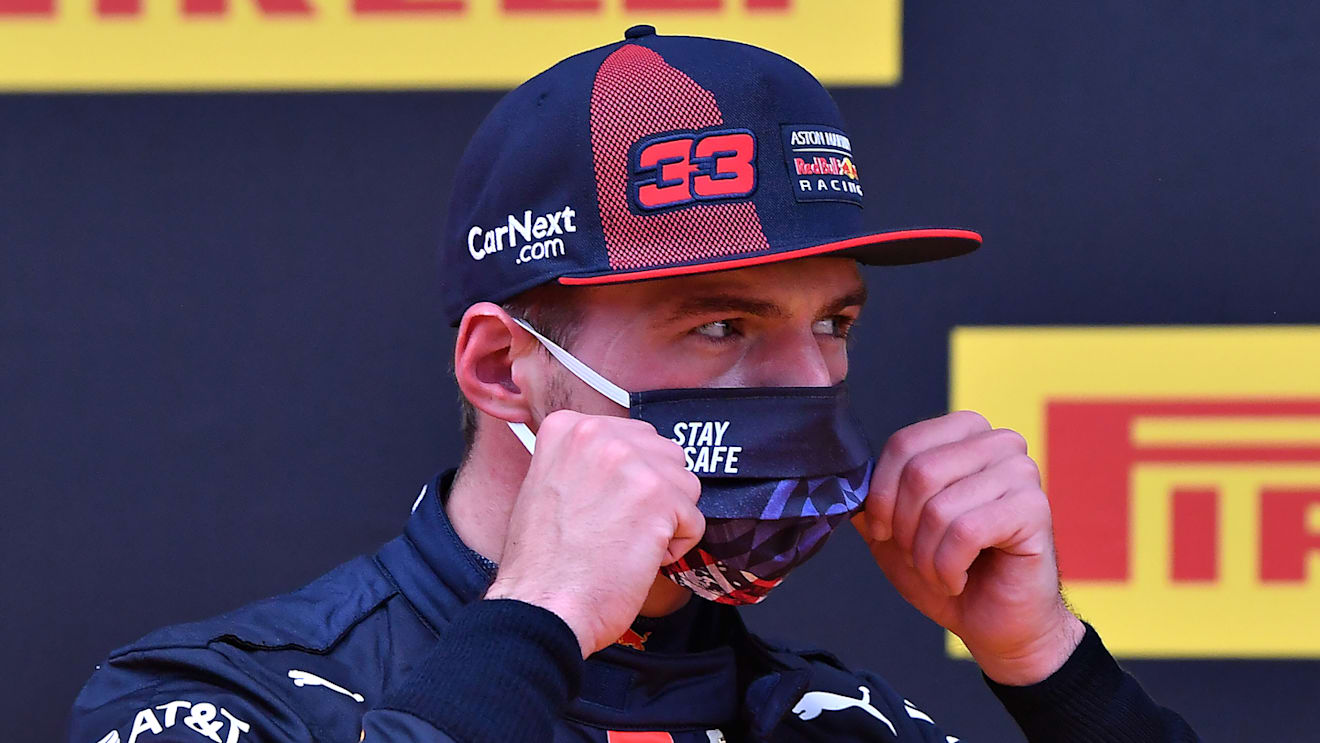 SPIELBERG, AUSTRIA - JULY 11: Second placed qualifier Max Verstappen of Netherlands and Red Bull Racing puts on his mask in parc ferme during qualifying for the Formula One Grand Prix of Styria at Red Bull Ring on July 11, 2020 in Spielberg, Austria. (Photo by Joe Klamar/Pool via Getty Images)