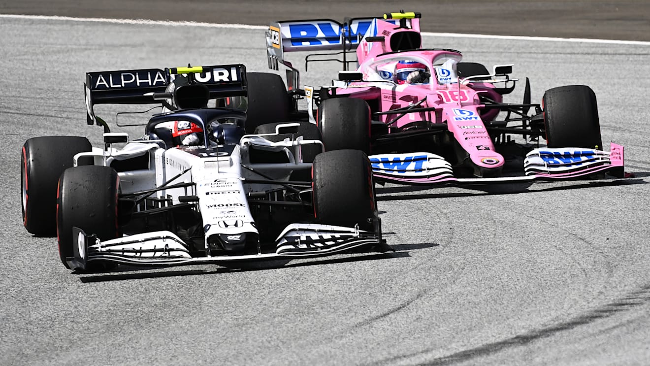 SPIELBERG, AUSTRIA - JULY 12: Pierre Gasly of France driving the (10) Scuderia AlphaTauri AT01 Honda battles for position with Lance Stroll of Canada driving the (18) Racing Point RP20 Mercedes during the Formula One Grand Prix of Styria at Red Bull Ring on July 12, 2020 in Spielberg, Austria. (Photo by Joe Klamar/Pool via Getty Images)