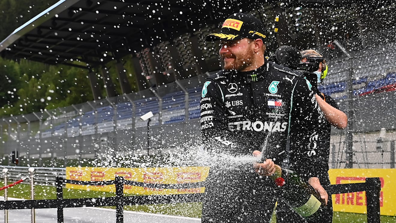 SPIELBERG, AUSTRIA - JULY 12: Second placed Valtteri Bottas of Finland and Mercedes GP celebrates on the podium after the Formula One Grand Prix of Styria at Red Bull Ring on July 12, 2020 in Spielberg, Austria. (Photo by Joe Klamar/Pool via Getty Images)