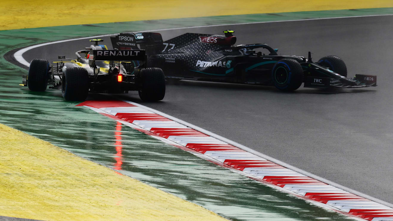 ISTANBUL, TURKEY - NOVEMBER 15: Valtteri Bottas of Finland driving the (77) Mercedes AMG Petronas F1 Team Mercedes W11 and Esteban Ocon of France driving the (31) Renault Sport Formula One Team RS20 spin off at the first corner at the start of the race during the F1 Grand Prix of Turkey at Intercity Istanbul Park on November 15, 2020 in Istanbul, Turkey. (Photo by Clive Mason/Getty Images)