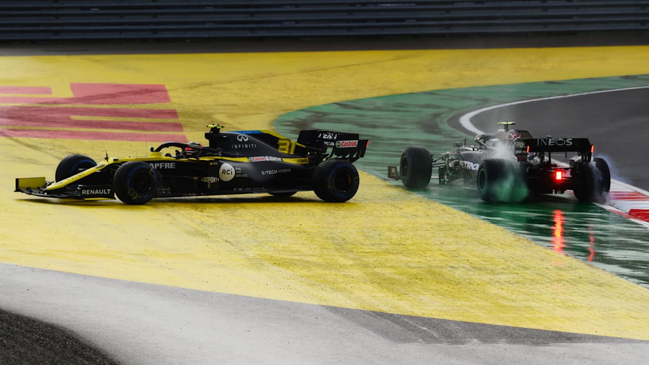 ISTANBUL, TURKEY - NOVEMBER 15: Valtteri Bottas of Finland driving the (77) Mercedes AMG Petronas F1 Team Mercedes W11 and Esteban Ocon of France driving the (31) Renault Sport Formula One Team RS20 spin off at the first corner at the start of the race during the F1 Grand Prix of Turkey at Intercity Istanbul Park on November 15, 2020 in Istanbul, Turkey. (Photo by Clive Mason/Getty Images)