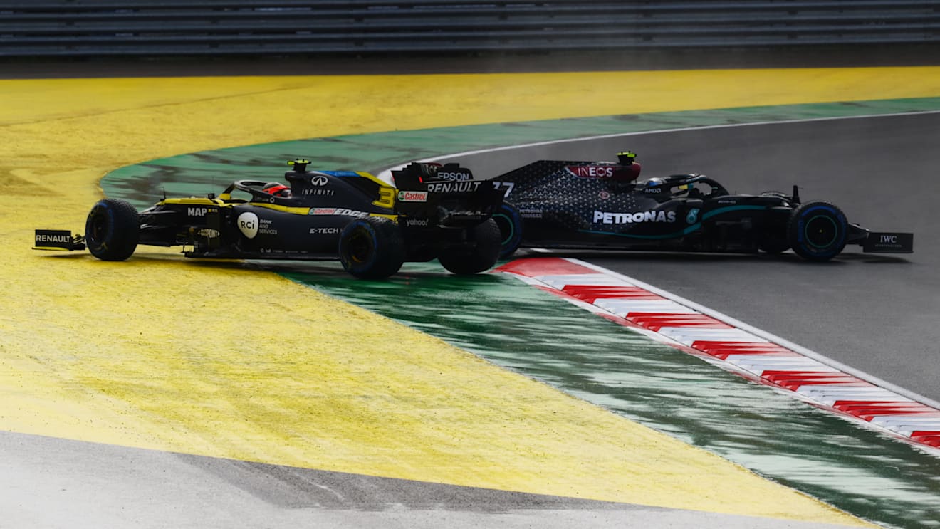ISTANBUL, TURKEY - NOVEMBER 15: Valtteri Bottas of Finland driving the (77) Mercedes AMG Petronas F1 Team Mercedes W11 and Esteban Ocon of France driving the (31) Renault Sport Formula One Team RS20 spin off at the first corner at the start of the race during the F1 Grand Prix of Turkey at Intercity Istanbul Park on November 15, 2020 in Istanbul, Turkey. (Photo by Clive Mason/Getty Images)