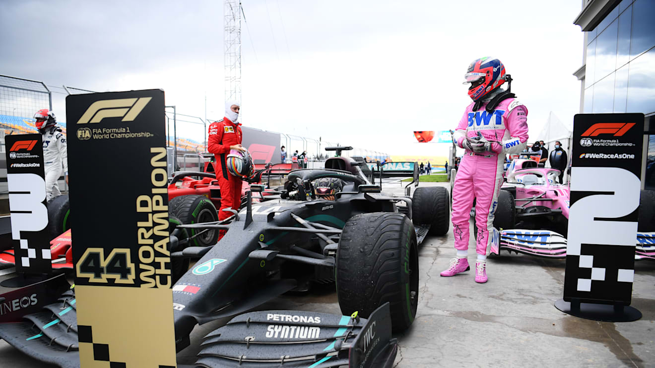 ISTANBUL, TURKEY - NOVEMBER 15: Race winner Lewis Hamilton of Great Britain and Mercedes GP is congratulated by Sebastian Vettel of Germany and Ferrari and Sergio Perez of Mexico and Racing Point in parc ferme after winning a 7th F1 World Drivers Championship during the F1 Grand Prix of Turkey at Intercity Istanbul Park on November 15, 2020 in Istanbul, Turkey. (Photo by Clive Mason/Getty Images)