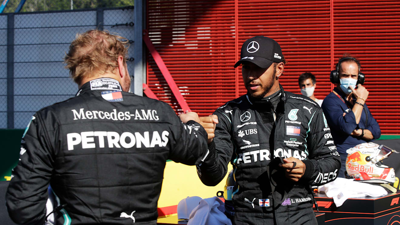 SCARPERIA, ITALY - SEPTEMBER 12: Pole position qualifier Lewis Hamilton of Great Britain and Mercedes GP celebrates with second placed qualifier Valtteri Bottas of Finland and Mercedes GP during qualifying for the F1 Grand Prix of Tuscany at Mugello Circuit on September 12, 2020 in Scarperia, Italy. (Photo by Luca Bruno - Pool/Getty Images)