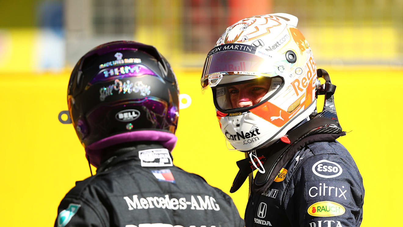 SCARPERIA, ITALY - SEPTEMBER 12: Pole position qualifier Lewis Hamilton of Great Britain and Mercedes GP and third placed qualifier Max Verstappen of Netherlands and Red Bull Racing talk in parc ferme during qualifying for the F1 Grand Prix of Tuscany at Mugello Circuit on September 12, 2020 in Scarperia, Italy. (Photo by Bryn Lennon/Getty Images)