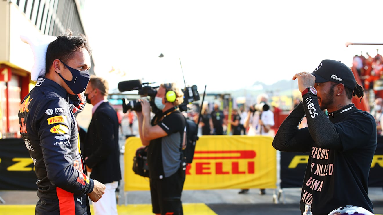 SCARPERIA, ITALY - SEPTEMBER 13: Third placed Alexander Albon of Thailand and Red Bull Racing speaks with race winner Lewis Hamilton of Great Britain and Mercedes GP in parc ferme during the F1 Grand Prix of Tuscany at Mugello Circuit on September 13, 2020 in Scarperia, Italy. (Photo by Bryn Lennon/Getty Images)