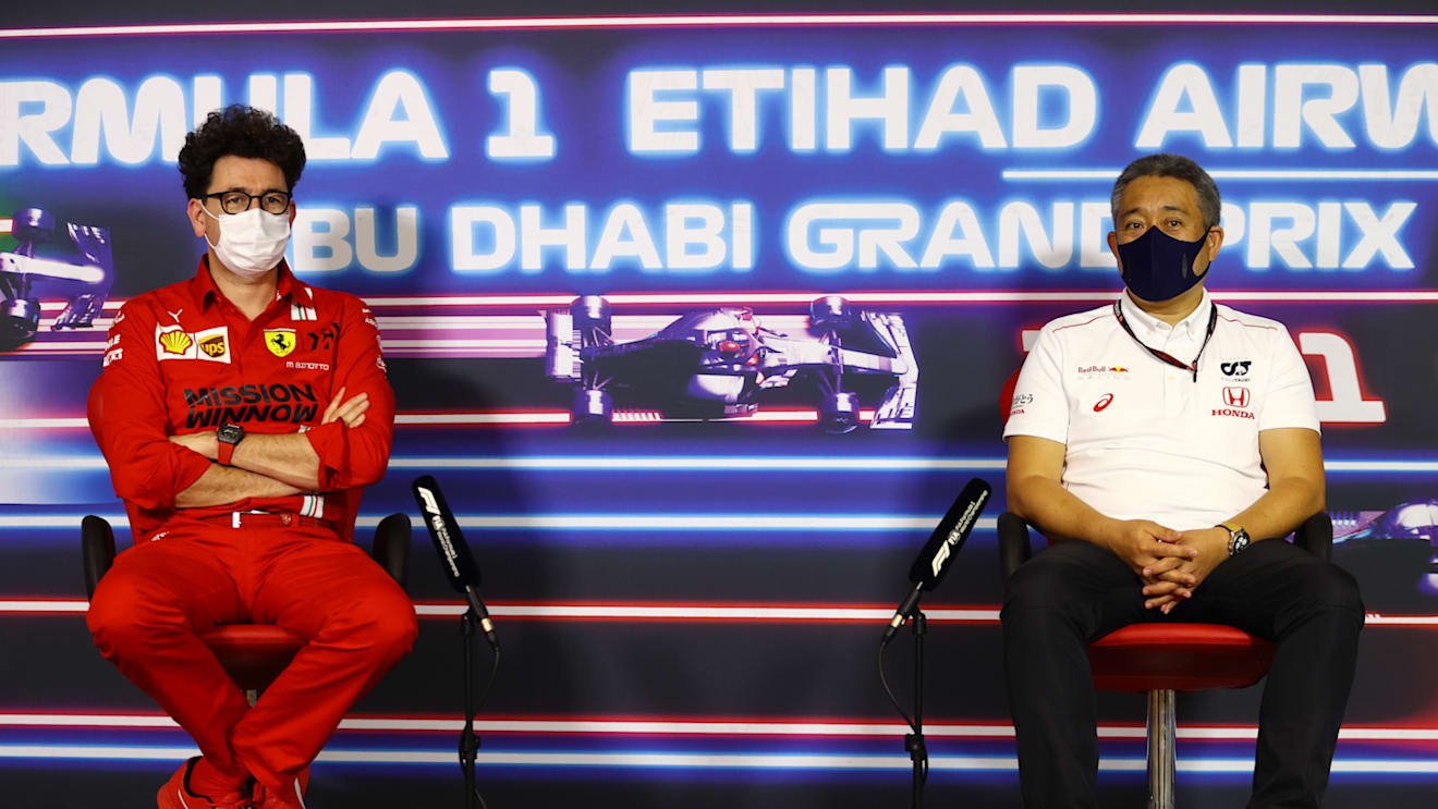 ABU DHABI, UNITED ARAB EMIRATES - DECEMBER 10: Scuderia Ferrari Team Principal Mattia Binotto and Masashi Yamamoto of Honda talk in the team principals press conference ahead of the F1 Grand Prix of Abu Dhabi at Yas Marina Circuit on December 10, 2021 in Abu Dhabi, United Arab Emirates. (Photo by Bryn Lennon/Getty Images)
