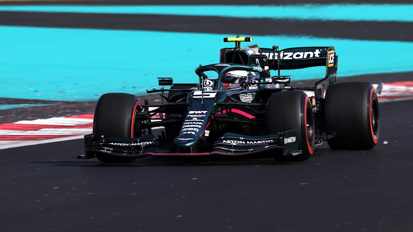 ABU DHABI, UNITED ARAB EMIRATES - DECEMBER 10: Sebastian Vettel of Germany driving the (5) Aston Martin AMR21 Mercedes during practice ahead of the F1 Grand Prix of Abu Dhabi at Yas Marina Circuit on December 10, 2021 in Abu Dhabi, United Arab Emirates. (Photo by Lars Baron/Getty Images)