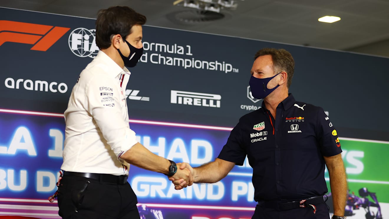 ABU DHABI, UNITED ARAB EMIRATES - DECEMBER 10: Mercedes GP Executive Director Toto Wolff and Red Bull Racing Team Principal Christian Horner shake hands in the team principals press conference ahead of the F1 Grand Prix of Abu Dhabi at Yas Marina Circuit on December 10, 2021 in Abu Dhabi, United Arab Emirates. (Photo by Bryn Lennon/Getty Images)
