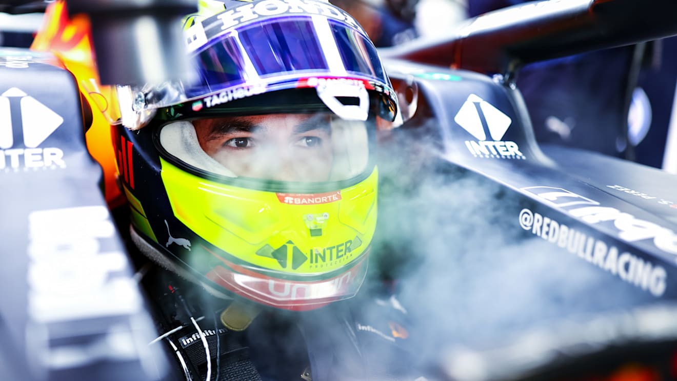 ABU DHABI, UNITED ARAB EMIRATES - DECEMBER 10: Sergio Perez of Mexico and Red Bull Racing prepares to drive in the garage during practice ahead of the F1 Grand Prix of Abu Dhabi at Yas Marina Circuit on December 10, 2021 in Abu Dhabi, United Arab Emirates. (Photo by Mark Thompson/Getty Images)