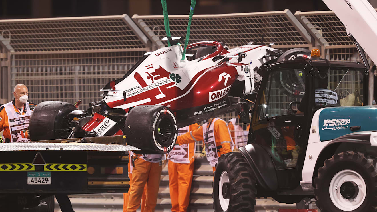 ABU DHABI, UNITED ARAB EMIRATES - DECEMBER 10: The car of Kimi Raikkonen of Finland and Alfa Romeo Racing is removed from the circuit after crashing during practice ahead of the F1 Grand Prix of Abu Dhabi at Yas Marina Circuit on December 10, 2021 in Abu Dhabi, United Arab Emirates. (Photo by Lars Baron/Getty Images)