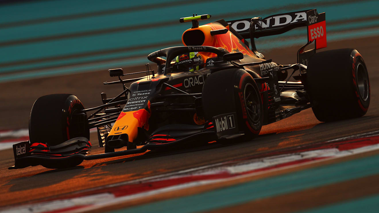 ABU DHABI, UNITED ARAB EMIRATES - DECEMBER 11: Sergio Perez of Mexico driving the (11) Red Bull Racing RB16B Honda during qualifying ahead of the F1 Grand Prix of Abu Dhabi at Yas Marina Circuit on December 11, 2021 in Abu Dhabi, United Arab Emirates. (Photo by Clive Rose/Getty Images)