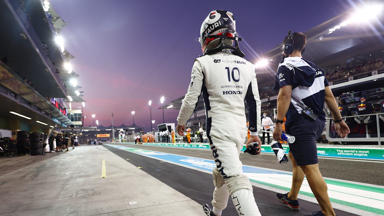 ABU DHABI, UNITED ARAB EMIRATES - DECEMBER 11: Pierre Gasly of France and Scuderia AlphaTauri walks in the Pitlane during qualifying ahead of the F1 Grand Prix of Abu Dhabi at Yas Marina Circuit on December 11, 2021 in Abu Dhabi, United Arab Emirates. (Photo by Mark Thompson/Getty Images)