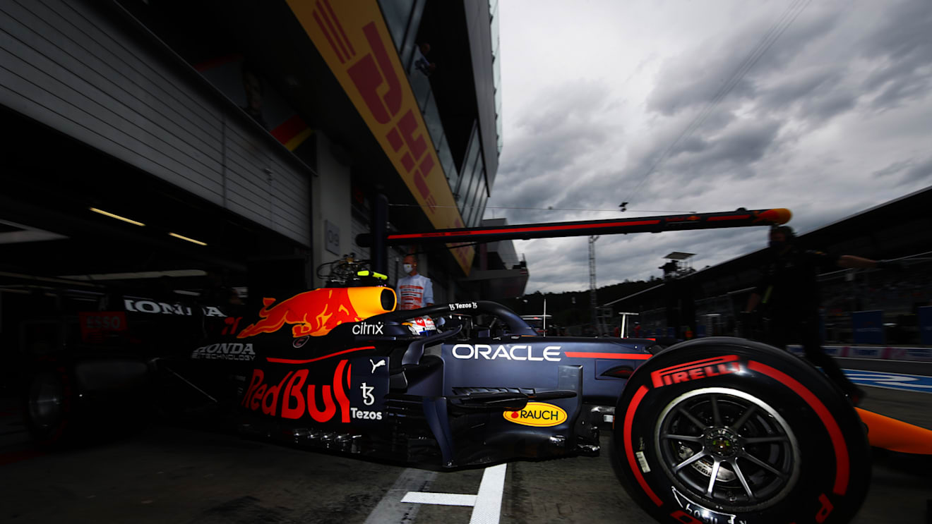 SPIELBERG, AUSTRIA - JULY 02: Sergio Perez of Mexico driving the (11) Red Bull Racing RB16B Honda leaves the garage during practice ahead of the F1 Grand Prix of Austria at Red Bull Ring on July 02, 2021 in Spielberg, Austria. (Photo by Mark Thompson/Getty Images)
