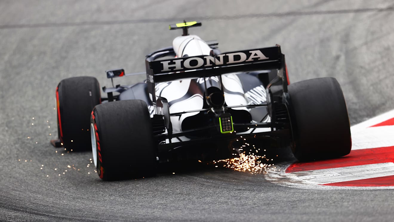 SPIELBERG, AUSTRIA - JULY 02: Sparks fly behind Pierre Gasly of France driving the (10) Scuderia AlphaTauri AT02 Honda during practice ahead of the F1 Grand Prix of Austria at Red Bull Ring on July 02, 2021 in Spielberg, Austria. (Photo by Clive Rose/Getty Images)