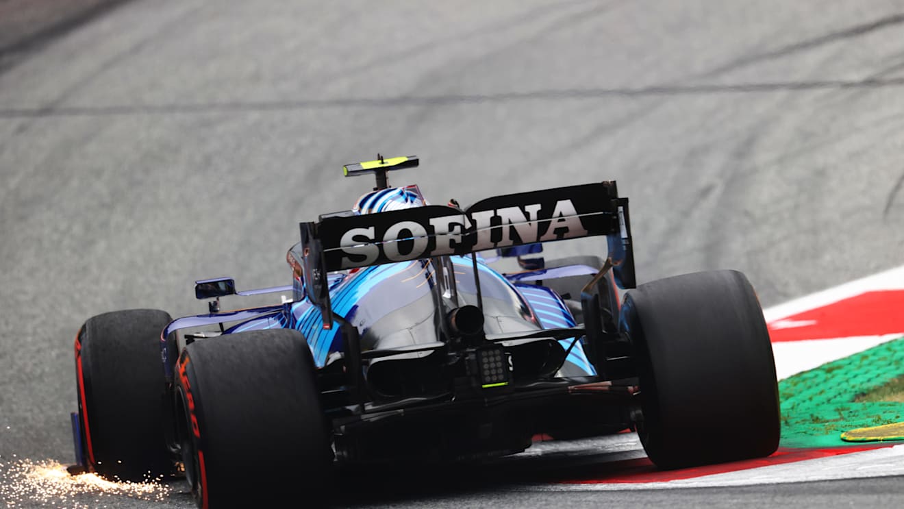 SPIELBERG, AUSTRIA - JULY 02: Sparks fly from the front wing of Nicholas Latifi of Canada driving the (6) Williams Racing FW43B Mercedes during practice ahead of the F1 Grand Prix of Austria at Red Bull Ring on July 02, 2021 in Spielberg, Austria. (Photo by Clive Rose/Getty Images)