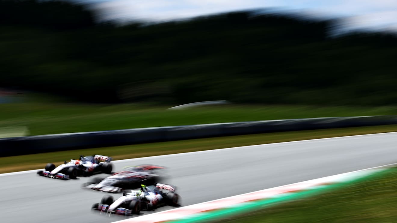 SPIELBERG, AUSTRIA - JULY 03: Mick Schumacher of Germany driving the (47) Haas F1 Team VF-21 Ferrari passes Antonio Giovinazzi of Italy driving the (99) Alfa Romeo Racing C41 Ferrari and Nikita Mazepin of Russia driving the (9) Haas F1 Team VF-21 Ferrari during final practice ahead of the F1 Grand Prix of Austria at Red Bull Ring on July 03, 2021 in Spielberg, Austria. (Photo by Bryn Lennon/Getty Images)