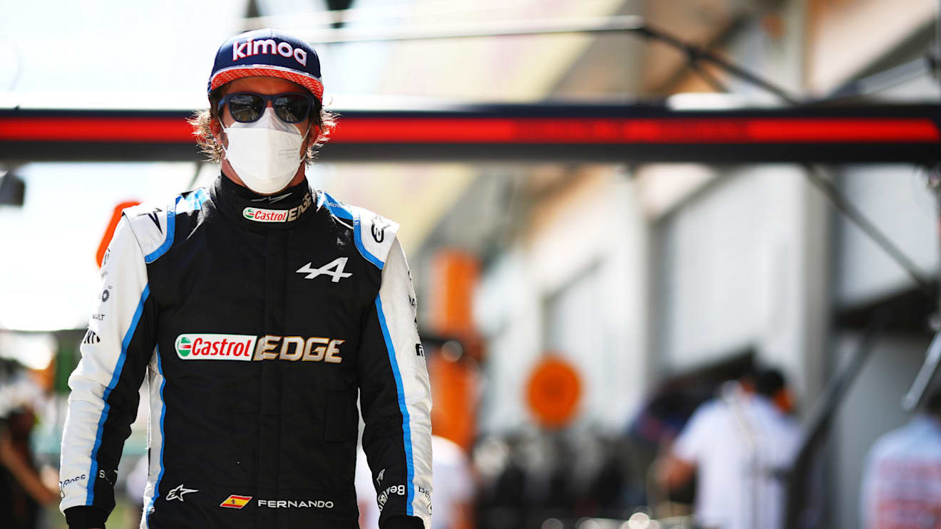 SPIELBERG, AUSTRIA - JULY 03: Fernando Alonso of Spain and Alpine F1 Team walks in the Pitlane during qualifying ahead of the F1 Grand Prix of Austria at Red Bull Ring on July 03, 2021 in Spielberg, Austria. (Photo by Mark Thompson/Getty Images)