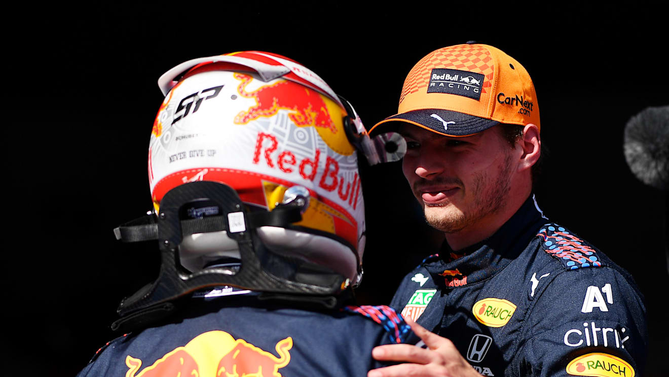 SPIELBERG, AUSTRIA - JULY 03: Pole position qualifier Max Verstappen of Netherlands and Red Bull Racing and third place qualifier Sergio Perez of Mexico and Red Bull Racing celebrate in parc ferme during qualifying ahead of the F1 Grand Prix of Austria at Red Bull Ring on July 03, 2021 in Spielberg, Austria. (Photo by Christian Bruna - Pool/Getty Images)