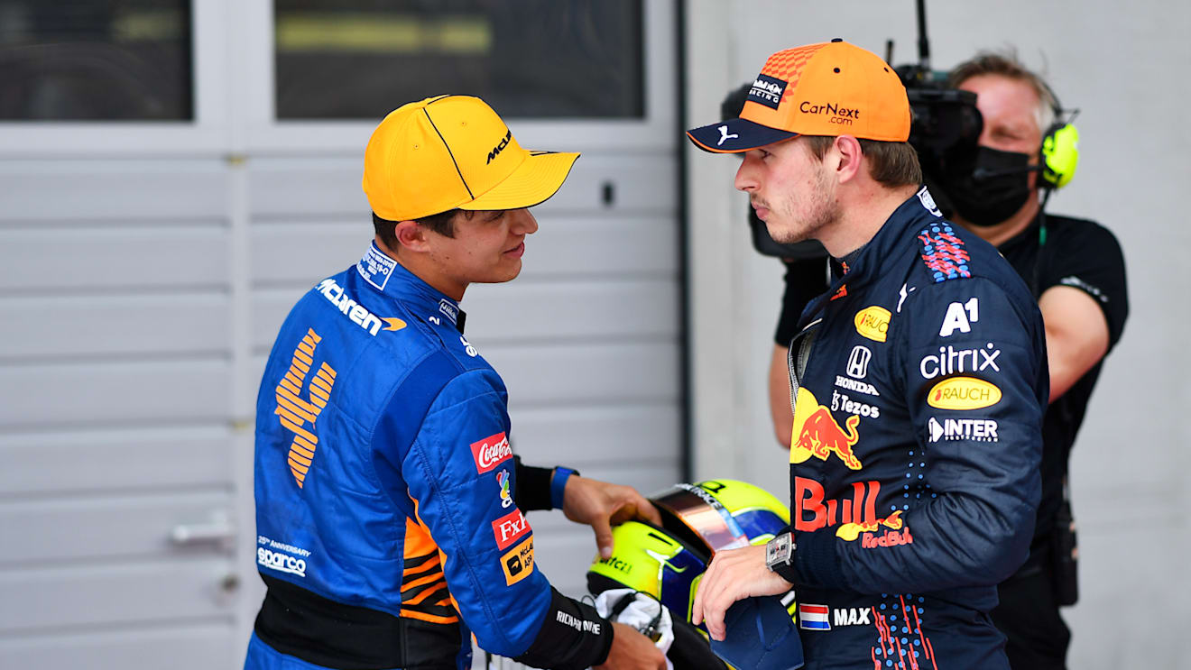 SPIELBERG, AUSTRIA - JULY 03: Pole position qualifier Max Verstappen of Netherlands and Red Bull Racing and second place qualifier Lando Norris of Great Britain and McLaren F1 talk in parc ferme during qualifying ahead of the F1 Grand Prix of Austria at Red Bull Ring on July 03, 2021 in Spielberg, Austria. (Photo by Christian Bruna - Pool/Getty Images)