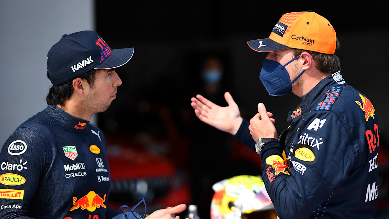 SPIELBERG, AUSTRIA - JULY 03: Pole position qualifier Max Verstappen of Netherlands and Red Bull Racing and third place qualifier Sergio Perez of Mexico and Red Bull Racing celebrate in parc ferme during qualifying ahead of the F1 Grand Prix of Austria at Red Bull Ring on July 03, 2021 in Spielberg, Austria. (Photo by Christian Bruna - Pool/Getty Images)
