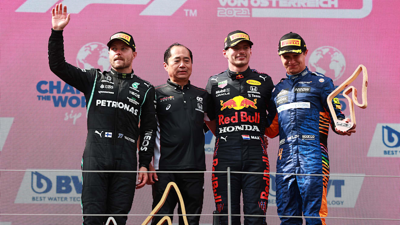 SPIELBERG, AUSTRIA - JULY 04: Race winner Max Verstappen of Netherlands and Red Bull Racing, second placed Valtteri Bottas of Finland and Mercedes GP, third placed Lando Norris of Great Britain and McLaren F1 and Toyoharu Tanabe of Honda celebrate on the podium during the F1 Grand Prix of Austria at Red Bull Ring on July 04, 2021 in Spielberg, Austria. (Photo by Mark Thompson/Getty Images)