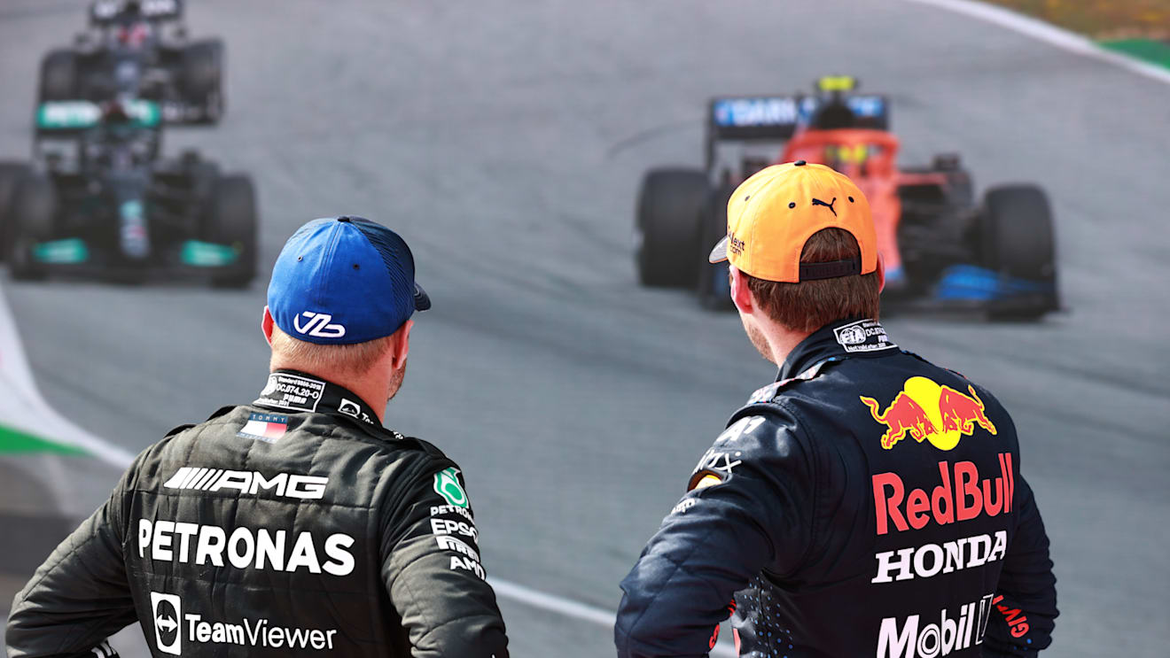 SPIELBERG, AUSTRIA - JULY 04: Race winner Max Verstappen of Netherlands and Red Bull Racing and second placed Valtteri Bottas of Finland and Mercedes GP talk in parc ferme during the F1 Grand Prix of Austria at Red Bull Ring on July 04, 2021 in Spielberg, Austria. (Photo by Mark Thompson/Getty Images)