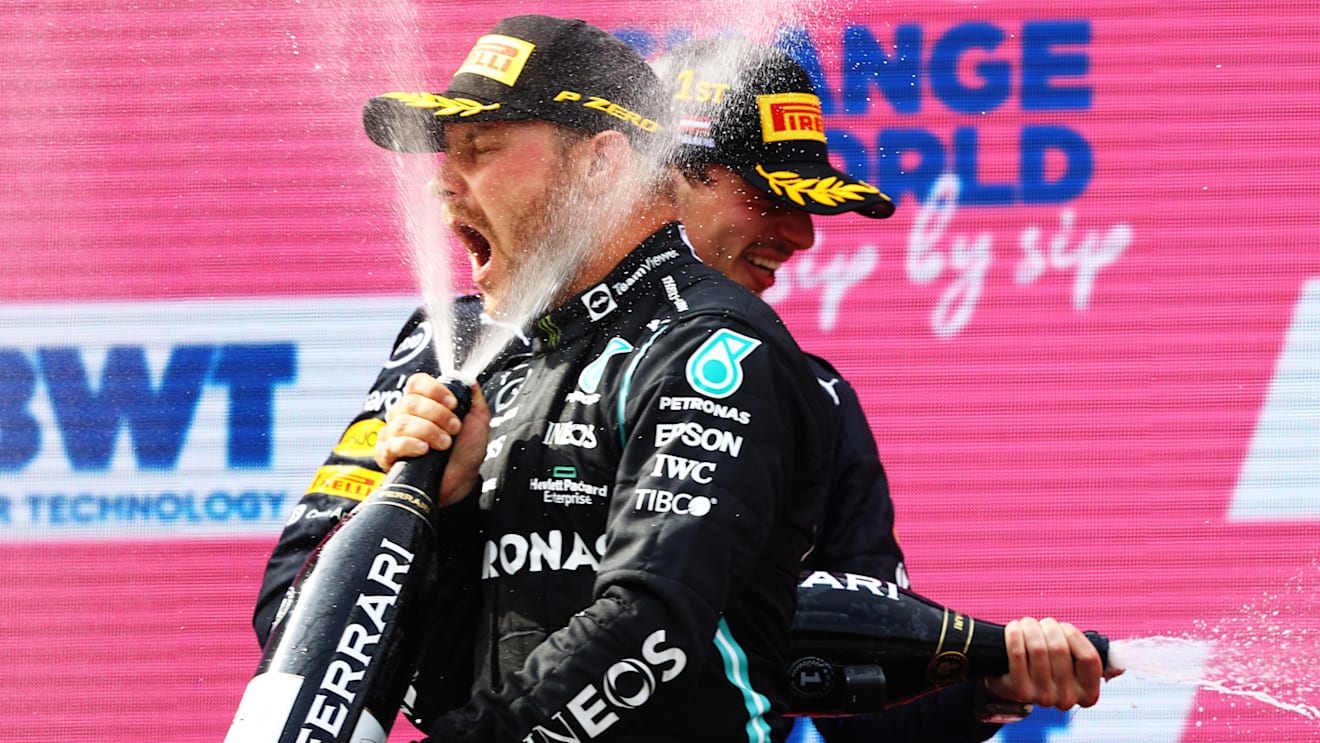 SPIELBERG, AUSTRIA - JULY 04: Second placed Valtteri Bottas of Finland and Mercedes GP celebrates on the podium during the F1 Grand Prix of Austria at Red Bull Ring on July 04, 2021 in Spielberg, Austria. (Photo by Bryn Lennon/Getty Images)
