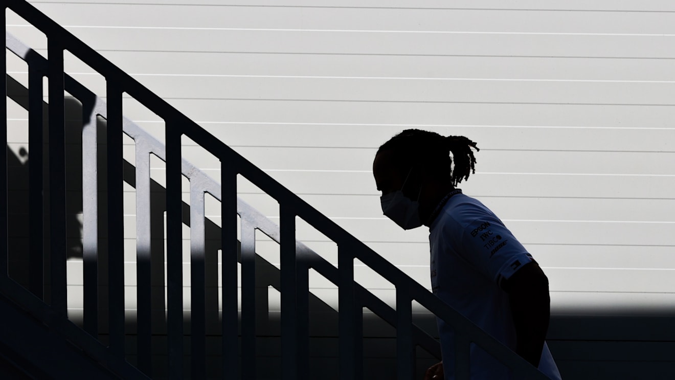 BAKU, AZERBAIJAN - JUNE 05: Lewis Hamilton of Great Britain and Mercedes GP walks in the Paddock during qualifying ahead of the F1 Grand Prix of Azerbaijan at Baku City Circuit on June 05, 2021 in Baku, Azerbaijan. (Photo by Mark Thompson/Getty Images)
