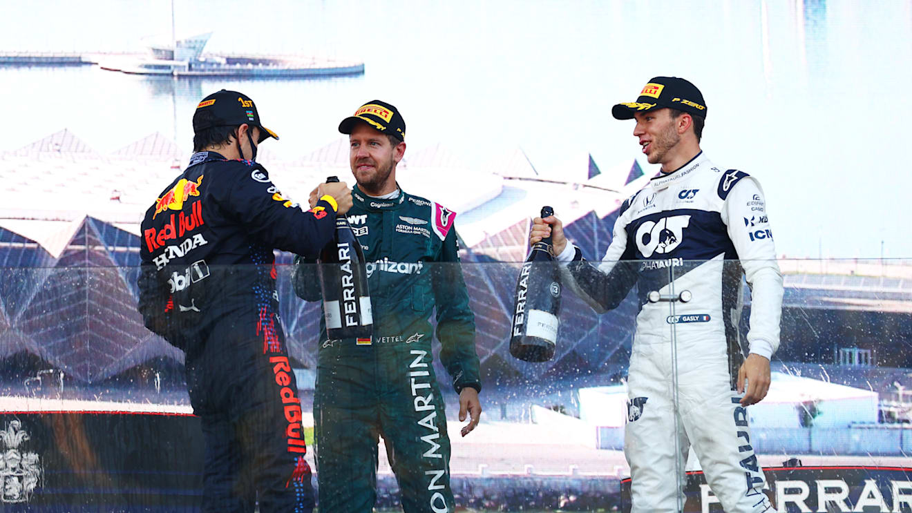 BAKU, AZERBAIJAN - JUNE 06: Race winner Sergio Perez of Mexico and Red Bull Racing, second placed Sebastian Vettel of Germany and Aston Martin F1 Team and third placed Pierre Gasly of France and Scuderia AlphaTauri celebrate on the podium during the F1 Grand Prix of Azerbaijan at Baku City Circuit on June 06, 2021 in Baku, Azerbaijan. (Photo by Dan Istitene - Formula 1/Formula 1 via Getty Images)