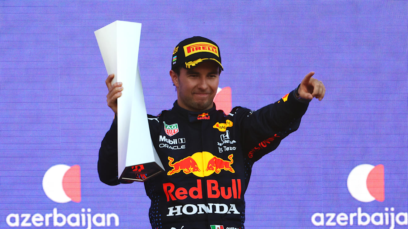 BAKU, AZERBAIJAN - JUNE 06: Race winner Sergio Perez of Mexico and Red Bull Racing celebrates on the podium during the F1 Grand Prix of Azerbaijan at Baku City Circuit on June 06, 2021 in Baku, Azerbaijan. (Photo by Francois Nel/Getty Images)