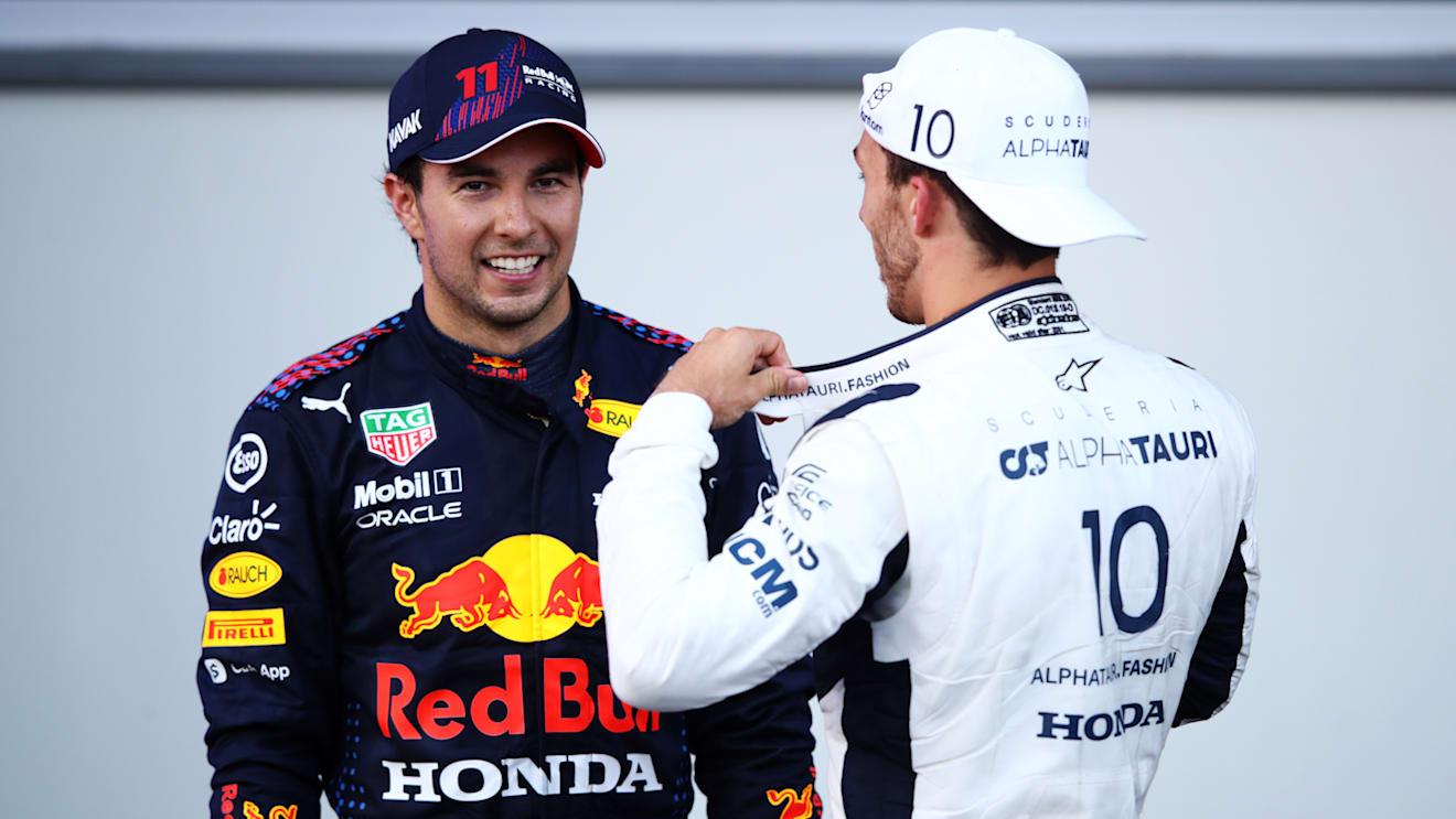 BAKU, AZERBAIJAN - JUNE 06: Race winner Sergio Perez of Mexico and Red Bull Racing and third placed Pierre Gasly of France and Scuderia AlphaTauri talk in parc ferme during the F1 Grand Prix of Azerbaijan at Baku City Circuit on June 06, 2021 in Baku, Azerbaijan. (Photo by Mark Thompson/Getty Images)