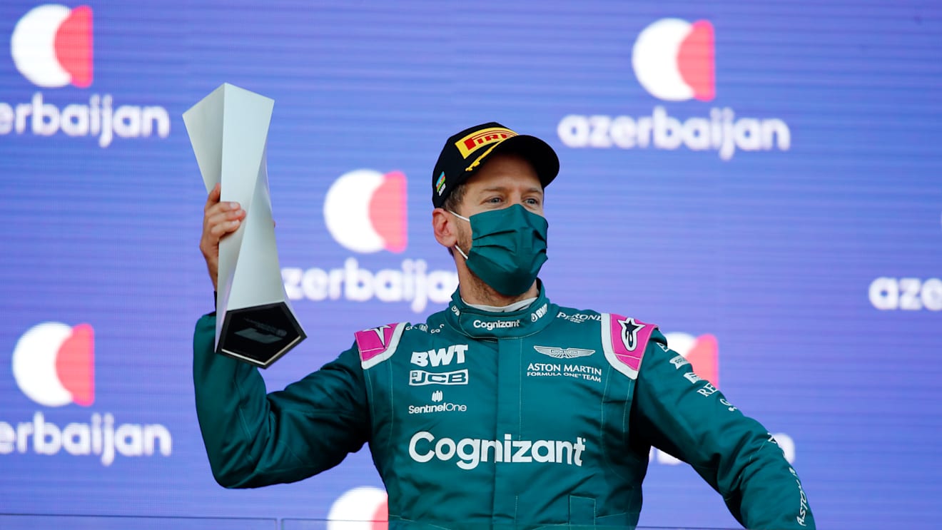 BAKU, AZERBAIJAN - JUNE 06: Second placed Sebastian Vettel of Germany and Aston Martin F1 Team celebrates on the podium during the F1 Grand Prix of Azerbaijan at Baku City Circuit on June 06, 2021 in Baku, Azerbaijan. (Photo by Maxim Shemetov - Pool/Getty Images)