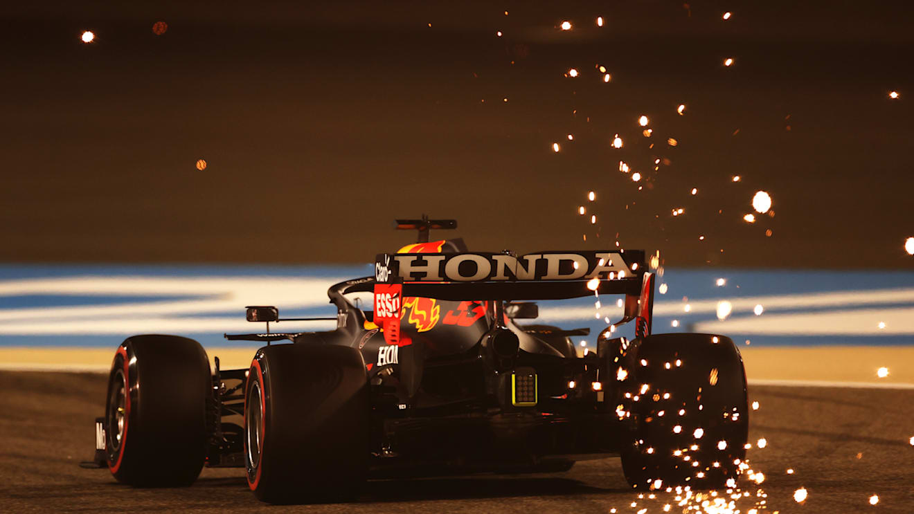 BAHRAIN, BAHRAIN - MARCH 26: Sparks fly behind Max Verstappen of the Netherlands driving the (33) Red Bull Racing RB16B Honda on track during practice ahead of the F1 Grand Prix of Bahrain at Bahrain International Circuit on March 26, 2021 in Bahrain, Bahrain. (Photo by Lars Baron/Getty Images)