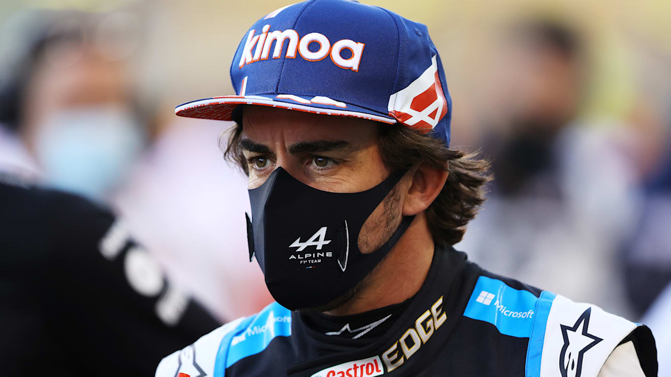 BAHRAIN, BAHRAIN - MARCH 28: Fernando Alonso of Spain and Alpine F1 Team looks on from the grid prior to the F1 Grand Prix of Bahrain at Bahrain International Circuit on March 28, 2021 in Bahrain, Bahrain. (Photo by Bryn Lennon/Getty Images)