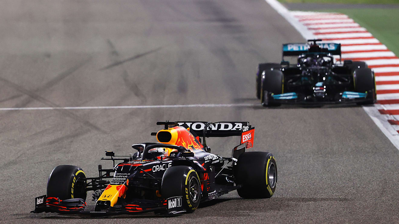 BAHRAIN, BAHRAIN - MARCH 28: Max Verstappen of the Netherlands driving the (33) Red Bull Racing RB16B Honda leads Lewis Hamilton of Great Britain driving the (44) Mercedes AMG Petronas F1 Team Mercedes W12 during the F1 Grand Prix of Bahrain at Bahrain International Circuit on March 28, 2021 in Bahrain, Bahrain. (Photo by Bryn Lennon/Getty Images)