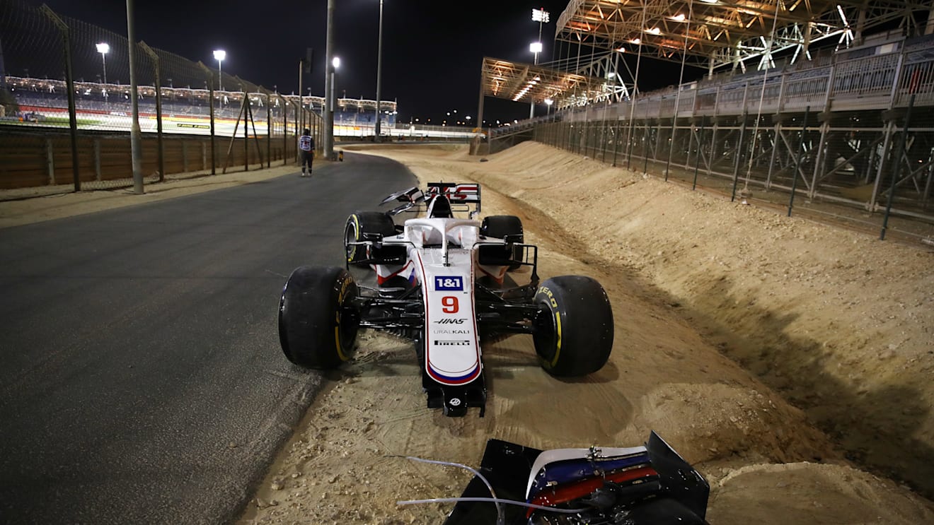 BAHRAIN, BAHRAIN - MARCH 28: The abandoned car of Nikita Mazepin of Russia and Haas F1 is seen at the side of the track after a colllision earlier in the race during the F1 Grand Prix of Bahrain at Bahrain International Circuit on March 28, 2021 in Bahrain, Bahrain. (Photo by Bryn Lennon/Getty Images)