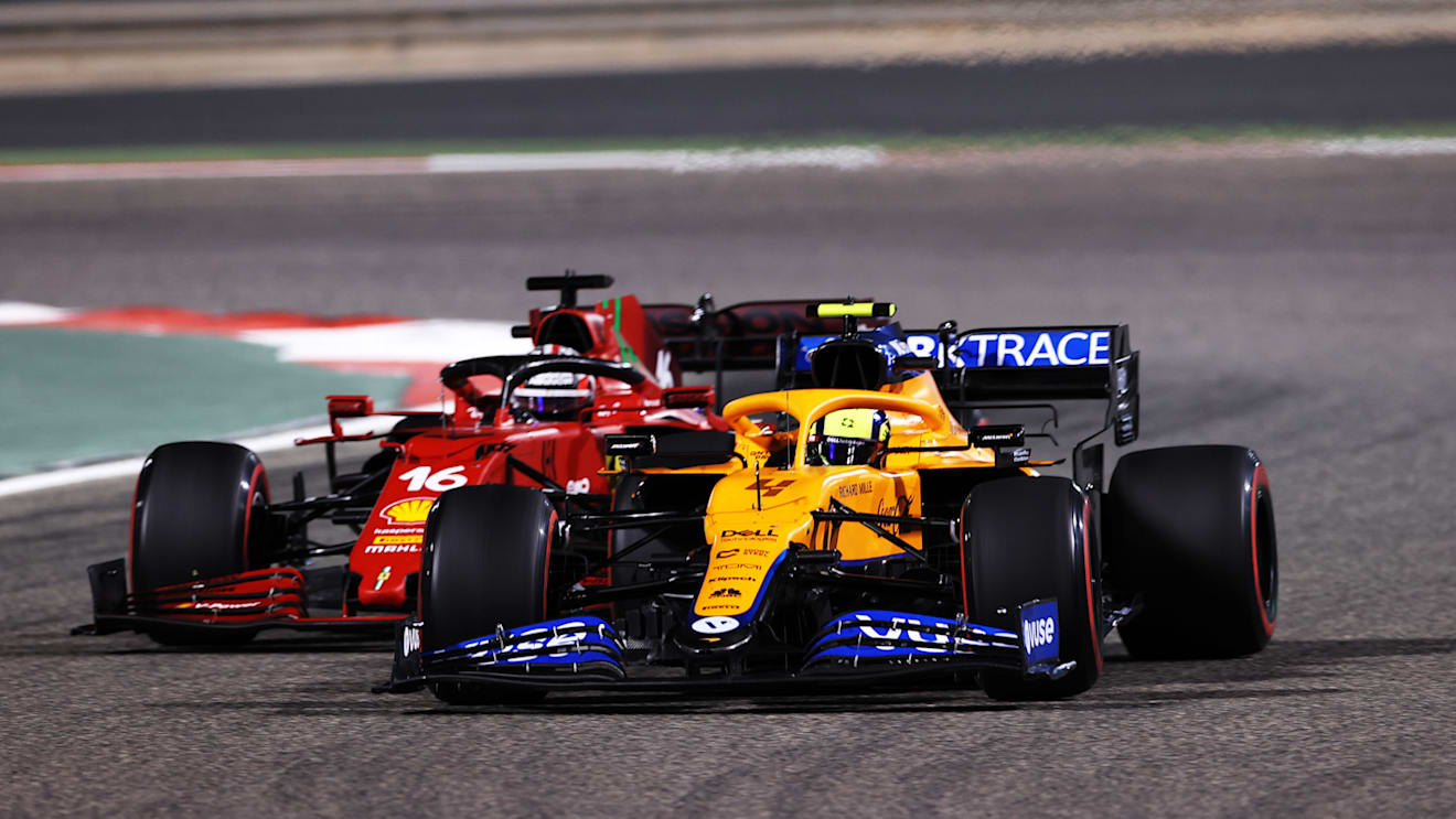 BAHRAIN, BAHRAIN - MARCH 28: Lando Norris of Great Britain driving the (4) McLaren F1 Team MCL35M Mercedes leads Charles Leclerc of Monaco driving the (16) Scuderia Ferrari SF21 during the F1 Grand Prix of Bahrain at Bahrain International Circuit on March 28, 2021 in Bahrain, Bahrain. (Photo by Lars Baron/Getty Images)