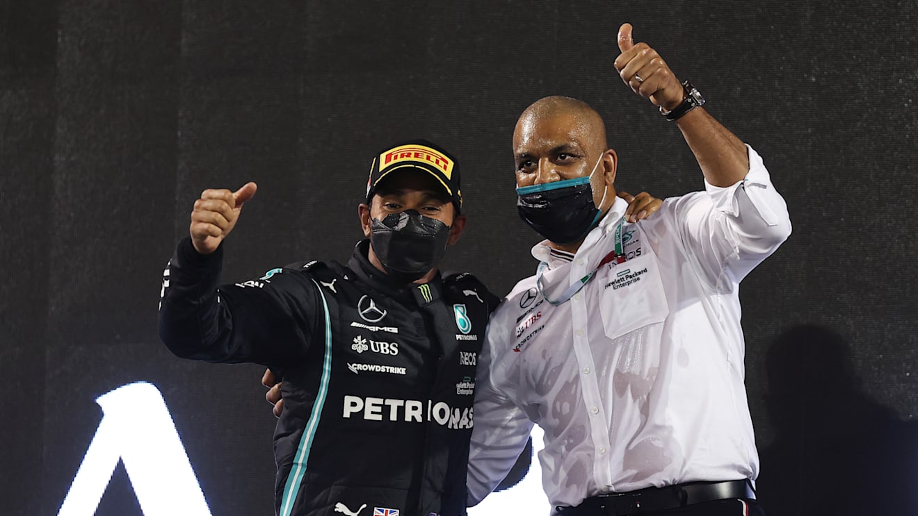 BAHRAIN, BAHRAIN - MARCH 28: Race winner Lewis Hamilton of Great Britain and Mercedes GP and Russell Braithwaite, Chief Financial Officer of Mercedes GP, celebrate on the podium during the F1 Grand Prix of Bahrain at Bahrain International Circuit on March 28, 2021 in Bahrain, Bahrain. (Photo by Lars Baron/Getty Images)