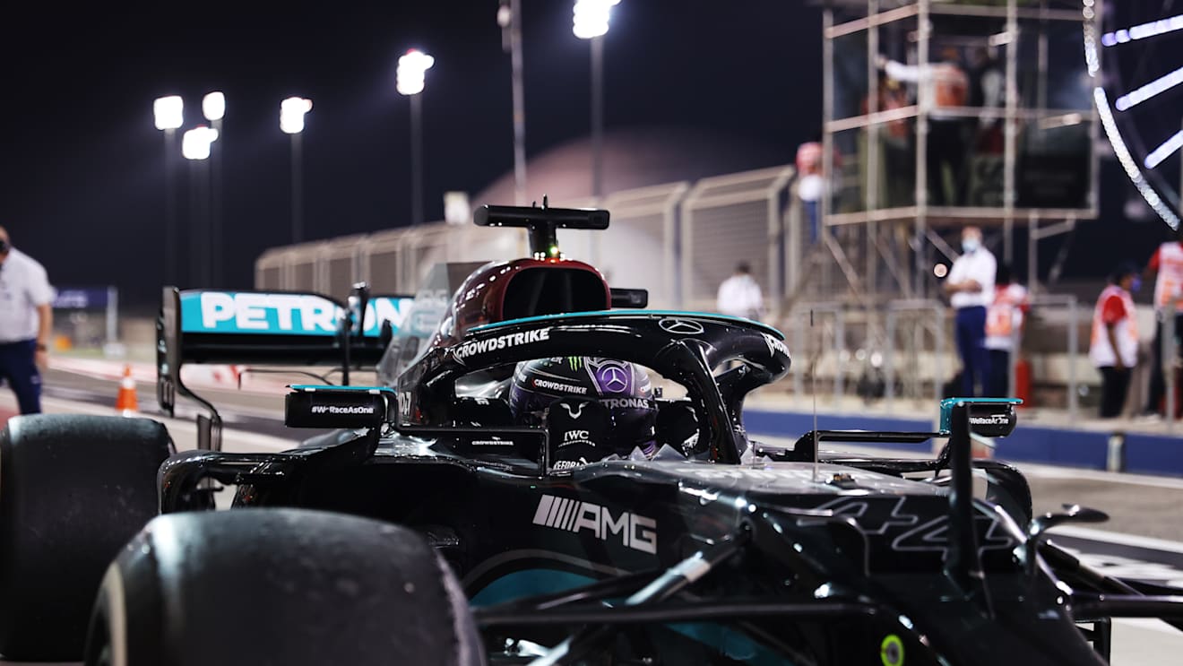 BAHRAIN, BAHRAIN - MARCH 28: Race Winner, Lewis Hamilton of Great Britain and Mercedes GP stops in parc ferme during the F1 Grand Prix of Bahrain at Bahrain International Circuit on March 28, 2021 in Bahrain, Bahrain. (Photo by Lars Baron/Getty Images)