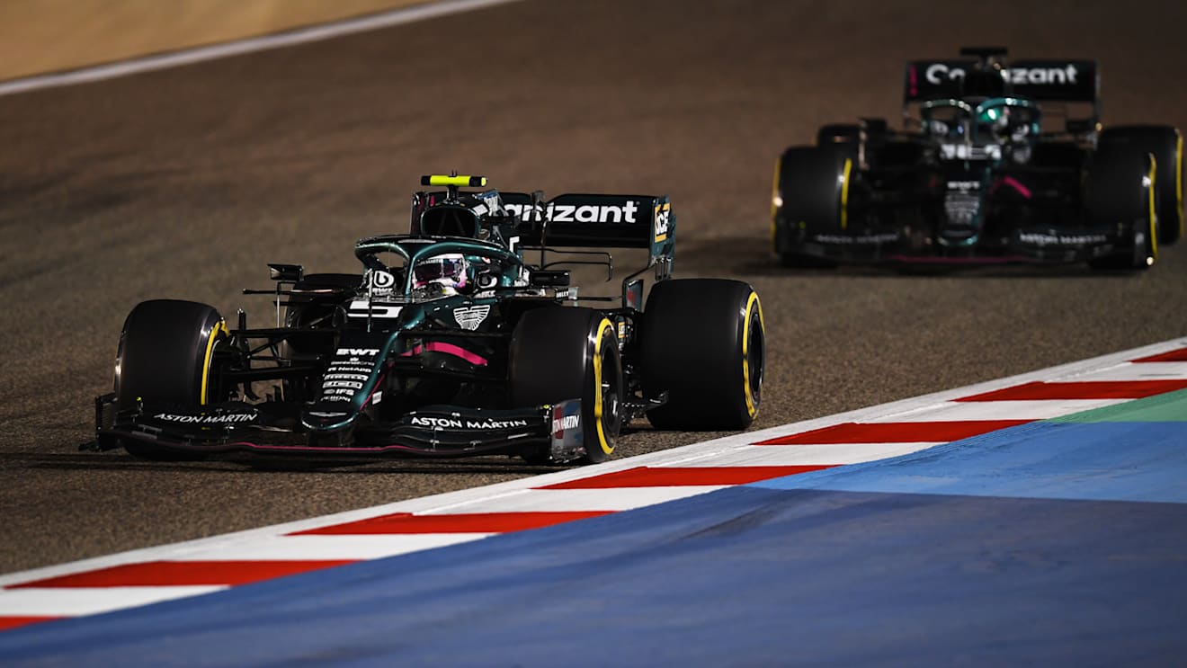 BAHRAIN, BAHRAIN - MARCH 28: Sebastian Vettel of Germany driving the (5) Aston Martin AMR21 Mercedes leads Lance Stroll of Canada driving the (18) Aston Martin AMR21 Mercedes on track during the F1 Grand Prix of Bahrain at Bahrain International Circuit on March 28, 2021 in Bahrain, Bahrain. (Photo by Clive Mason - Formula 1/Formula 1 via Getty Images)